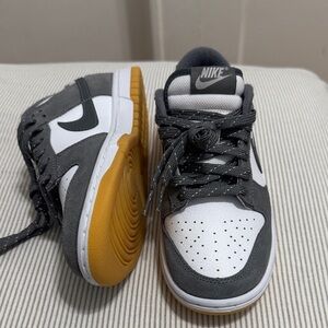 Nike Kids Gray, White, and Gold Sneakers